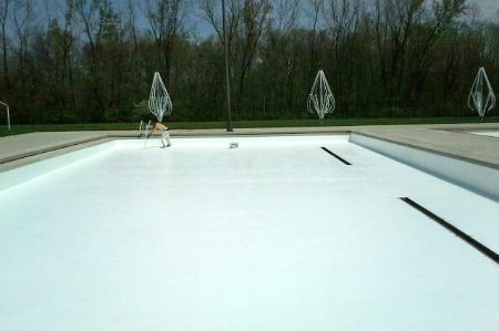 A large commercial pool painted white