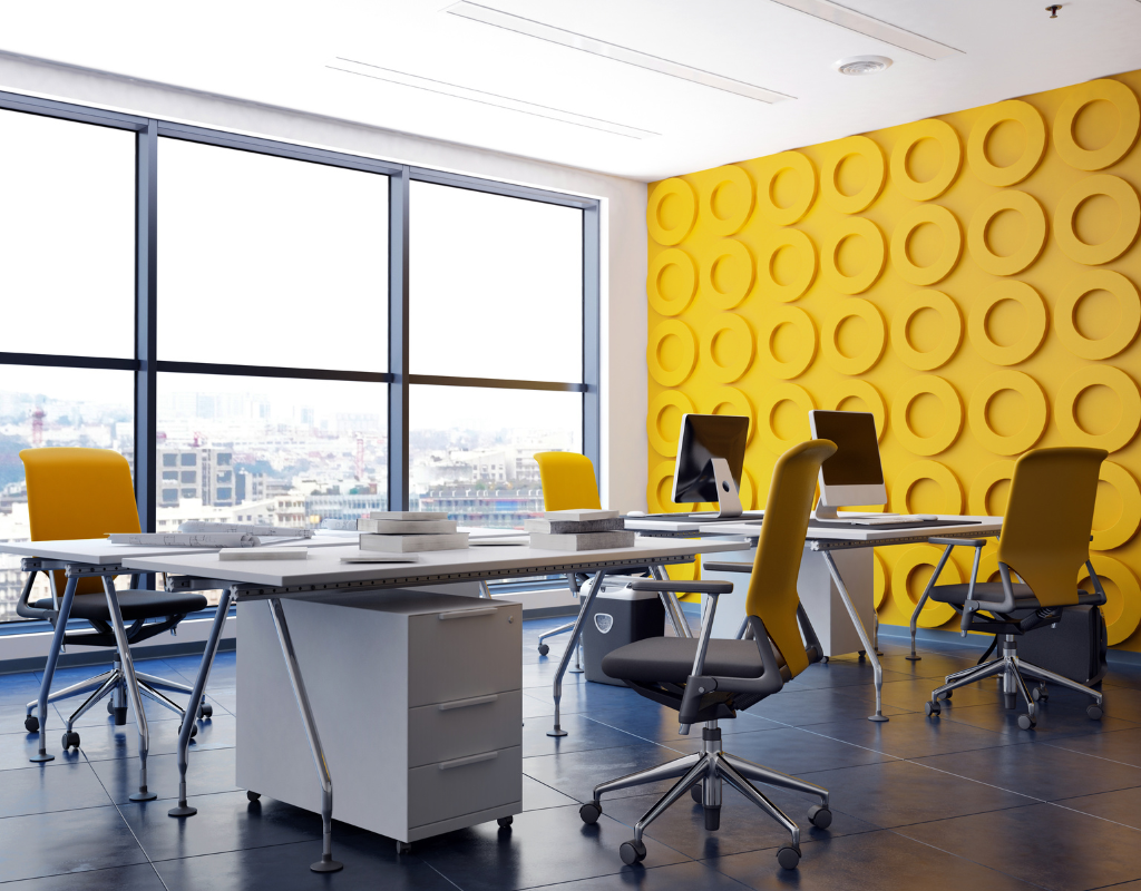 An office wall painted in a bright yellow