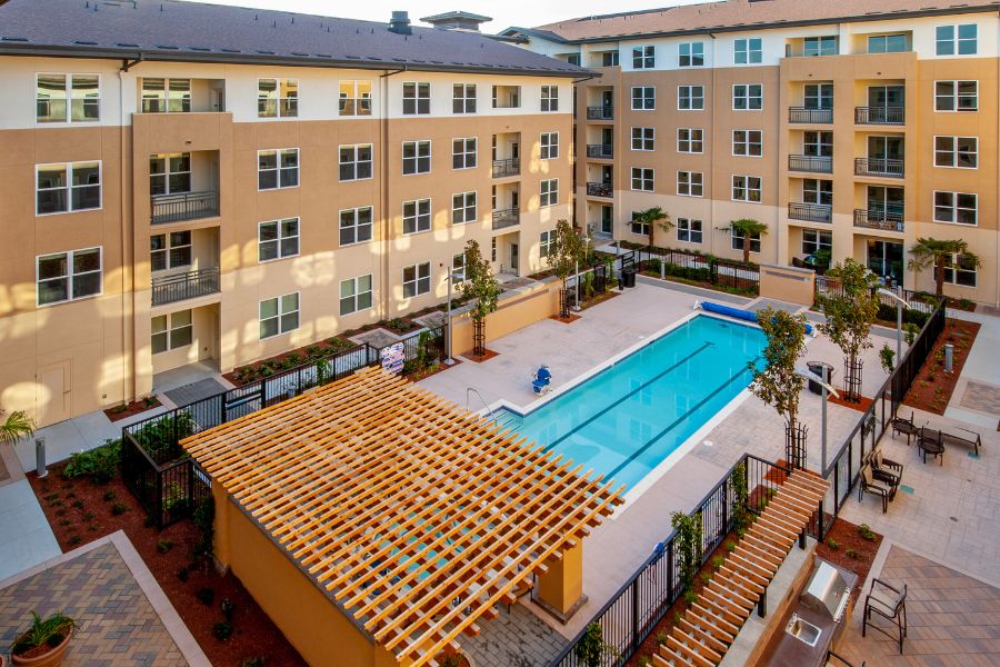 painted commercial pool in columbus surrounded by apartments painted in a warm tan color