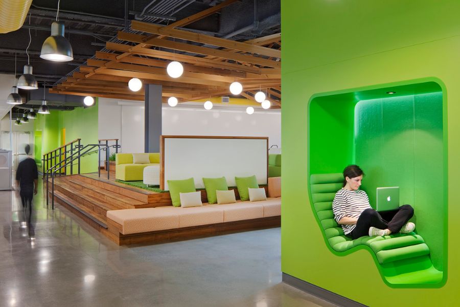 an open concept work space with vibrant green walls
