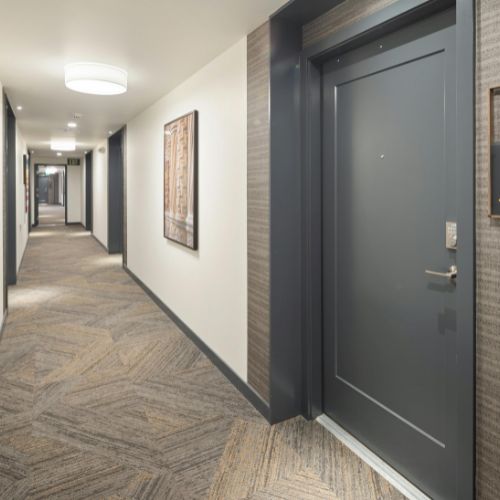 columbus apartments interior of apartment complex in downtown columbus. Doors painted in a muted gray and walls in a soft cream