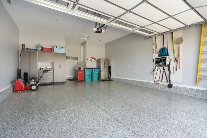 a shining and reflective gray epoxy garage floor with white flakes