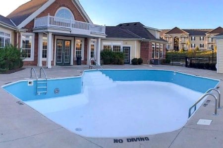 a hotel pool freshly painted in two tones, aqua and white, in Hilliard Ohio