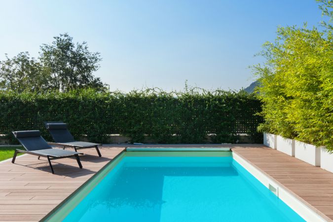 Pool Repainting Myths a freshly painted pool in aquamarine